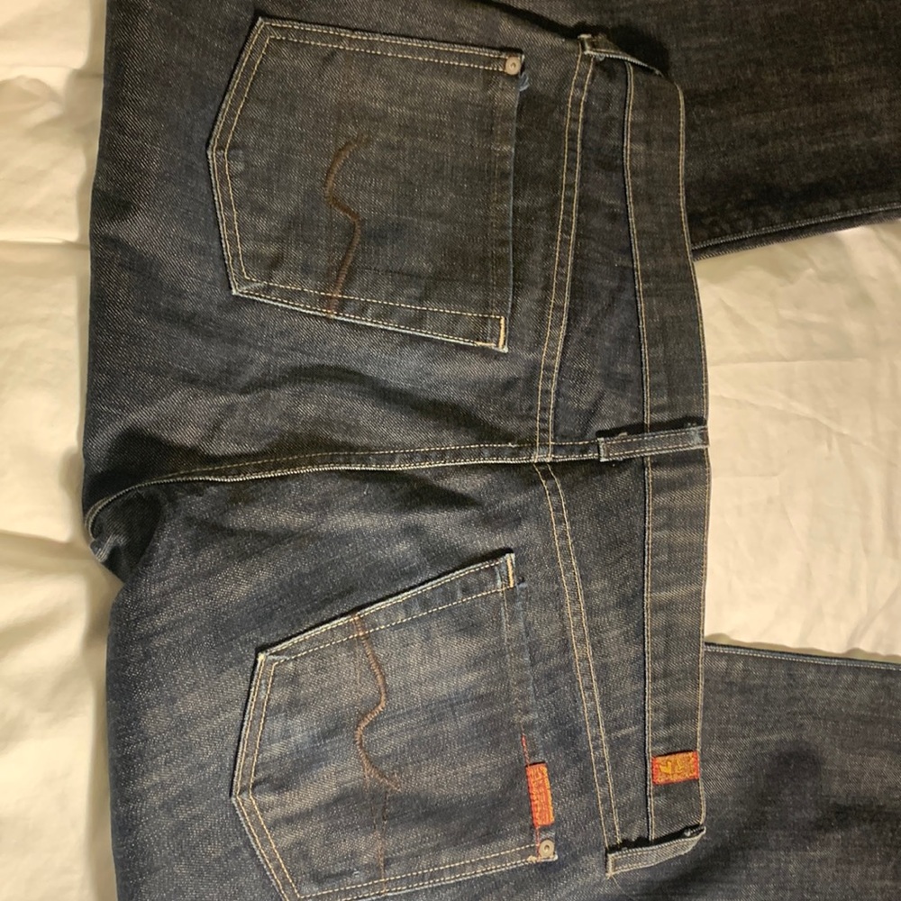 Never worn, button fly, bootcut jeans.